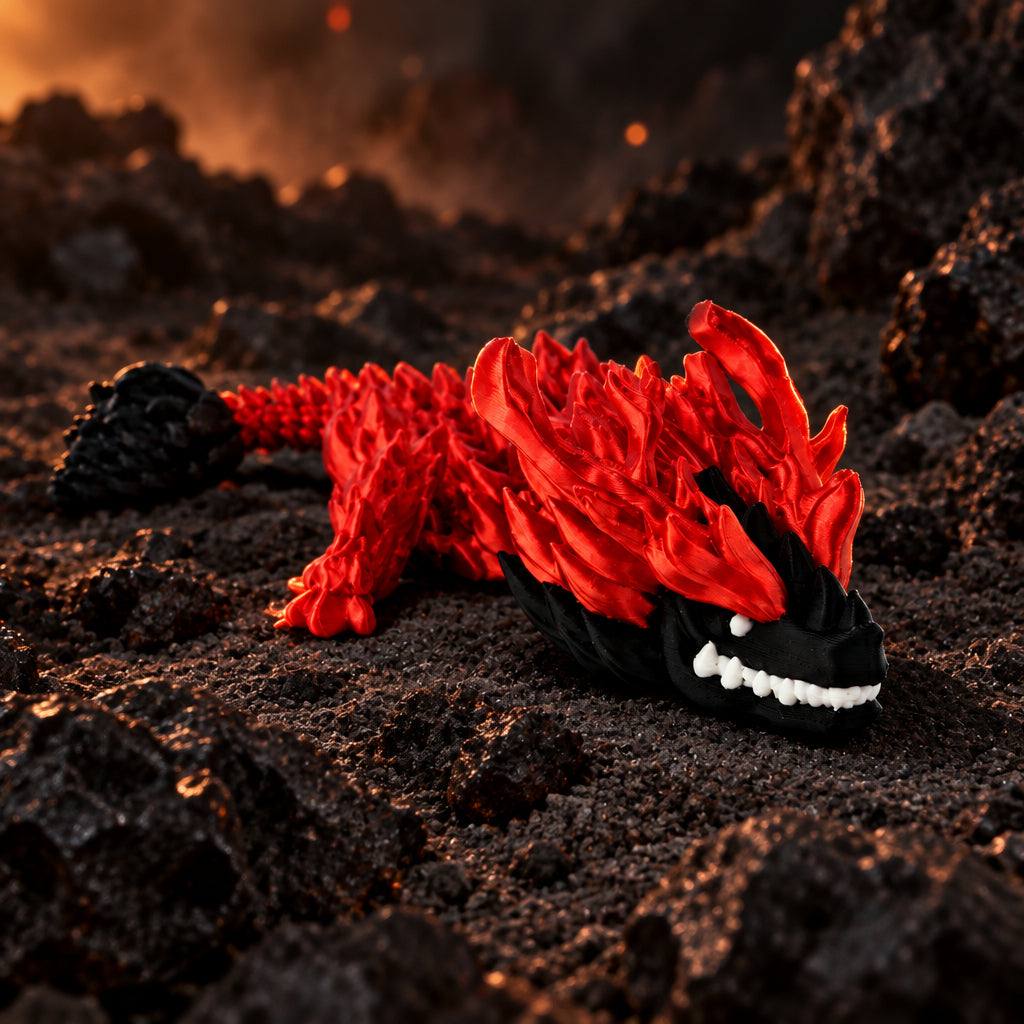 Rood met zwarte 3D-geprinte bloodfang baby draak in een sfeervolle vulkanische omgeving met rotsen en gloeidraden.