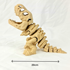 Zijaanzicht van de flexibele beige skelet T-Rex met maataanduidingen in centimeters.